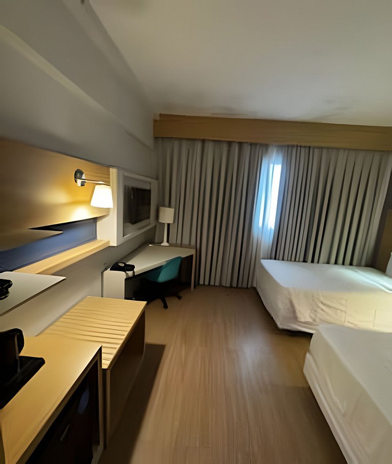 Studio com 2 camas na quadra da praia